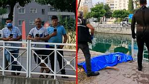 Adana'da, sulama kanalında boğulan gencin cansız bedeni çıkarılırken vatandaşlar telefona sarıldı