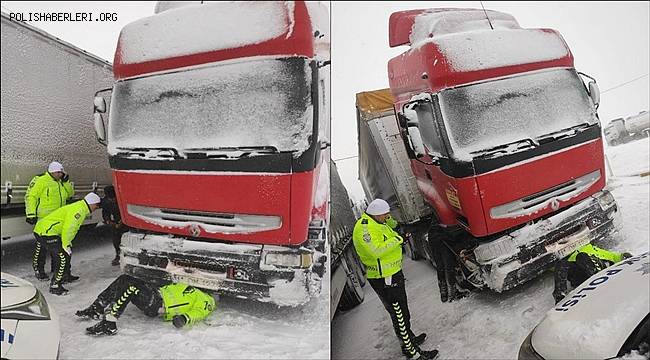 Trafik polisi, eksi 8 derecede karın üzerine yatıp TIR'ın arızasını giderdi 