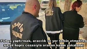 Hatay’ın Payas ilçesinde fuhuş yaptırmak, aracılık ve yer temin etmekten 64 yıl hapis cezasıyla aranan kadın yakalandı.