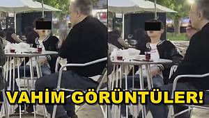 Vahim görüntüler! Küçücük çocuk ailesinin yanında sigara içti, bir de halka çıkardı 